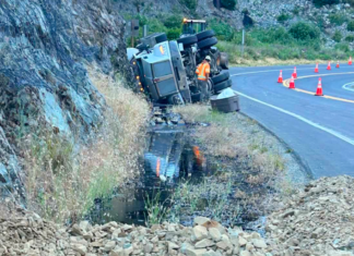 Truck Transporting Hazardous Materials Crashes, Closing Hwy. 199, Injuring the Driver and Spilling Material into Smith River